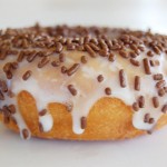 Vanilla Frosted Chocolate Sprinkle Vanilla Frosted Chocolate Topped Cake Donut